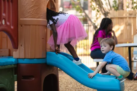 Children playing on the playground slide