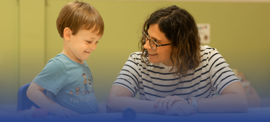 Teacher interacting with a young student at La Maternelle, a French immersion preschool in Houston