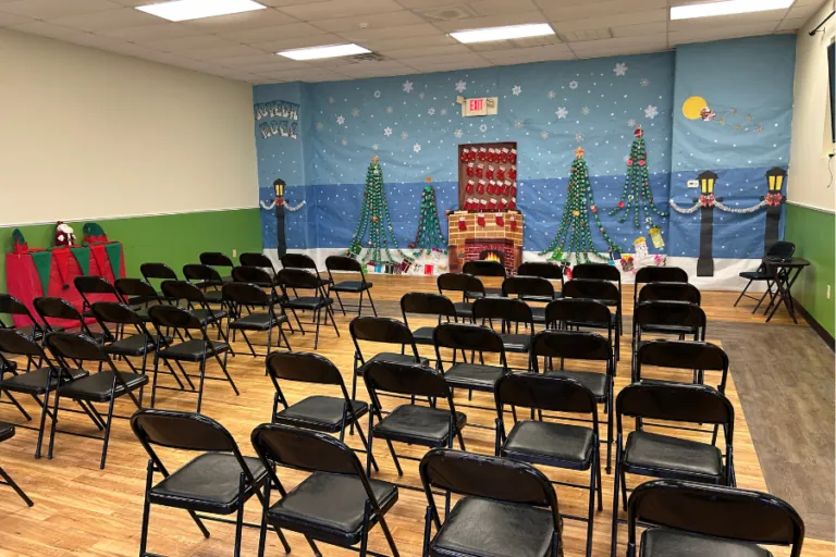 Chairs set up for a holiday show in the school hall