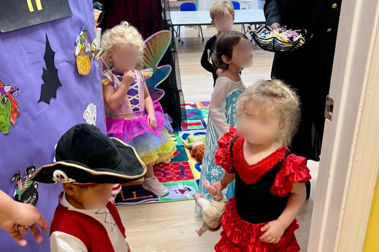 Children in pirate and princess costumes in the hallway
