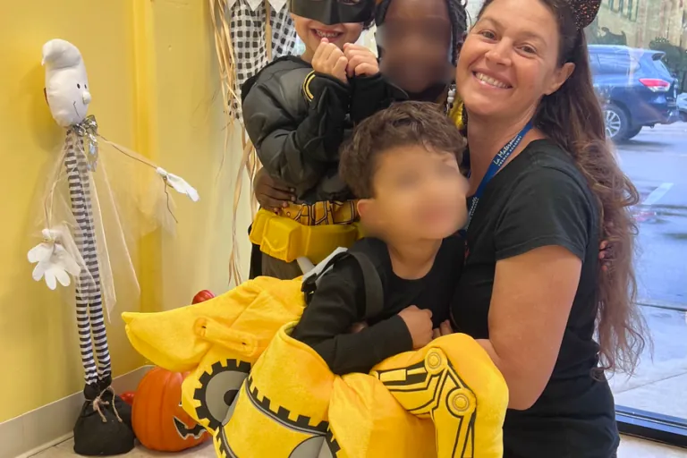 Teacher and child in costume at the Halloween celebration