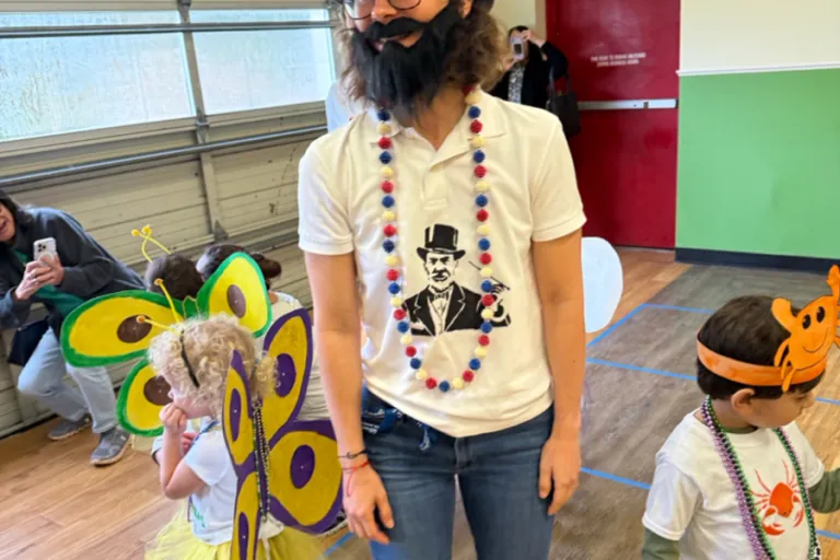 Teacher in a Carnival costume with children